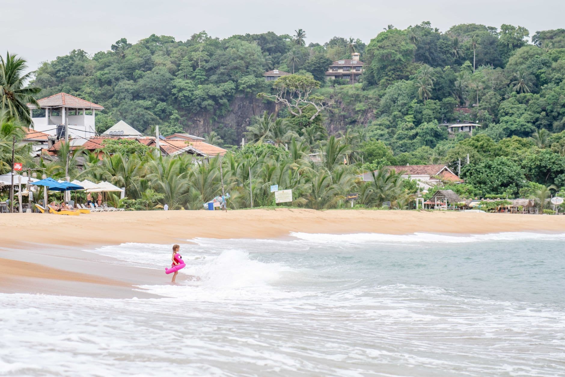 Gentle waves on the long golden beach at Hikkaduwa
