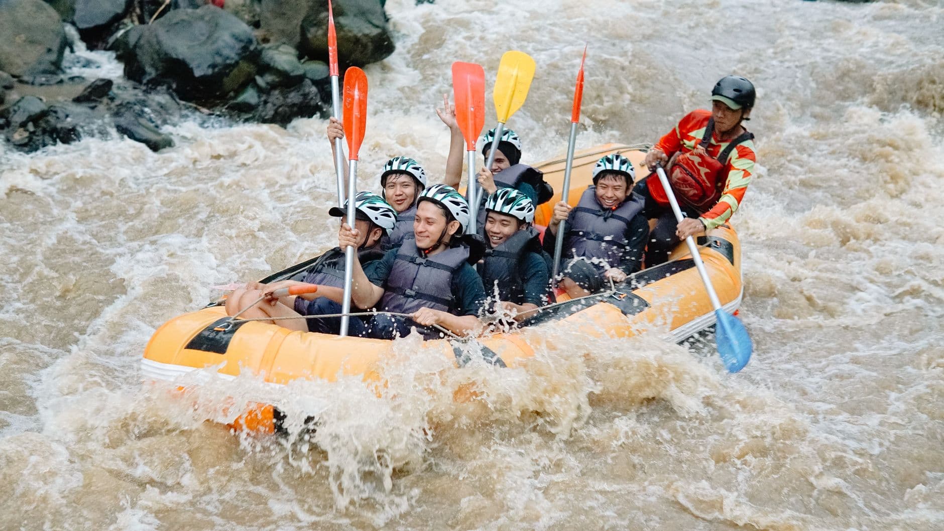 Paddlers hitting white water on the Kelani