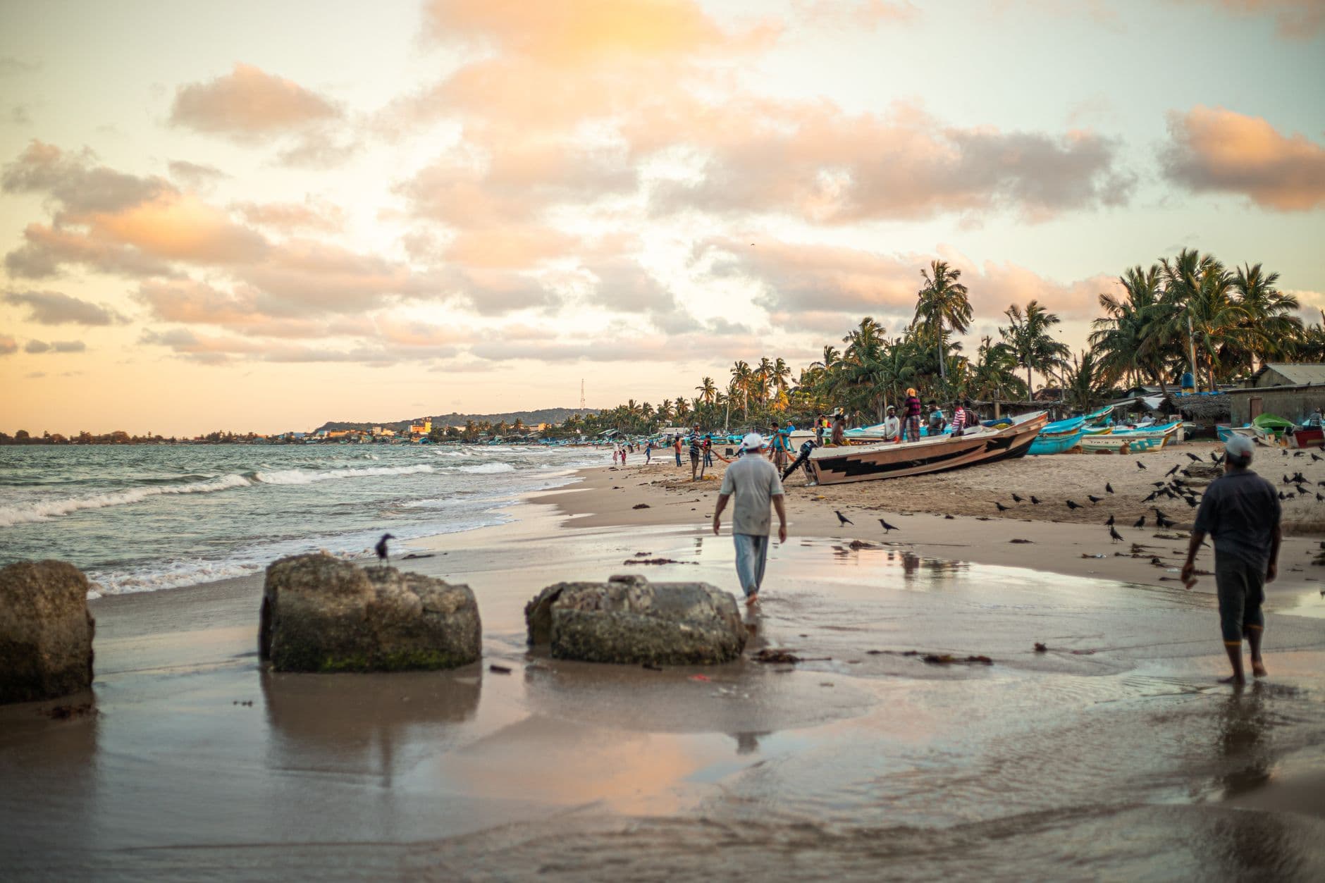 Fishing boats and evening light on a Trincomalee town beach